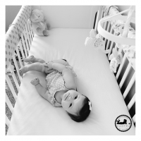 Favorite Black & White Baby Photo of 2015 Adorable baby girl in her crib in her nursery