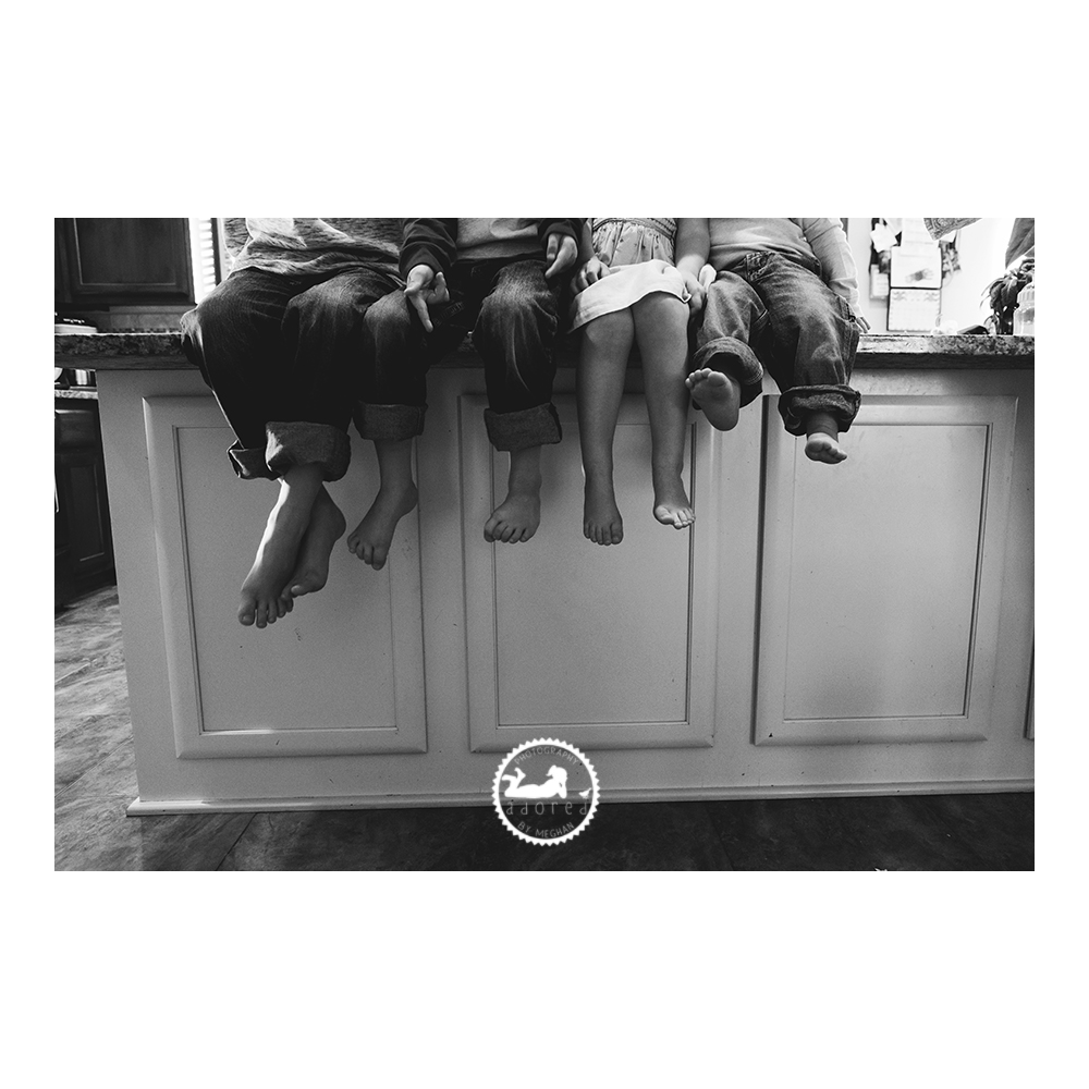 When having a professional portrait session, keep in mind capturing some photos that can be recreated as the years go by, that show the growth of your family. Adored by Meghan does just that in this photo of siblings sitting close together on their kitchen island, with their feet dangling over the side, showing the sizes of the kids. Adored by Meghan is a lifestyle photographer, Pasco, WA.