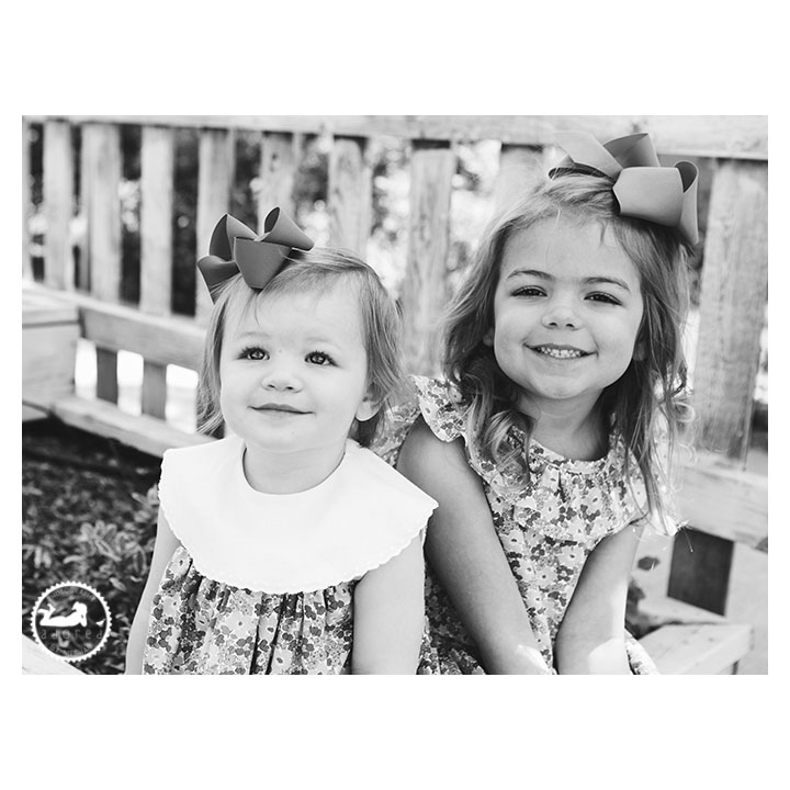 Black and White portrait of Sisters in the garden during mini-session with Adored by Meghan