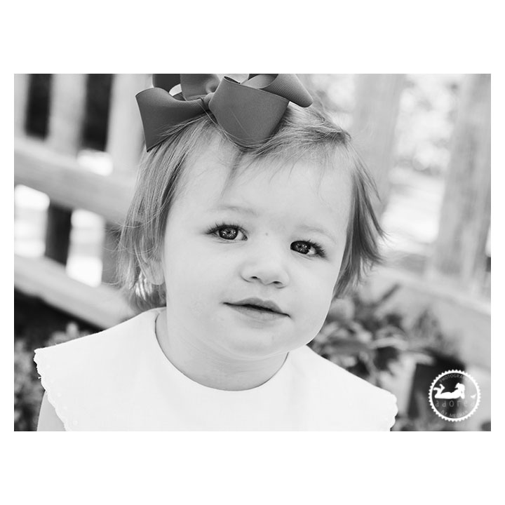 Black and White portrait of a Little girl in the garden during mini-session with Adored by Meghan