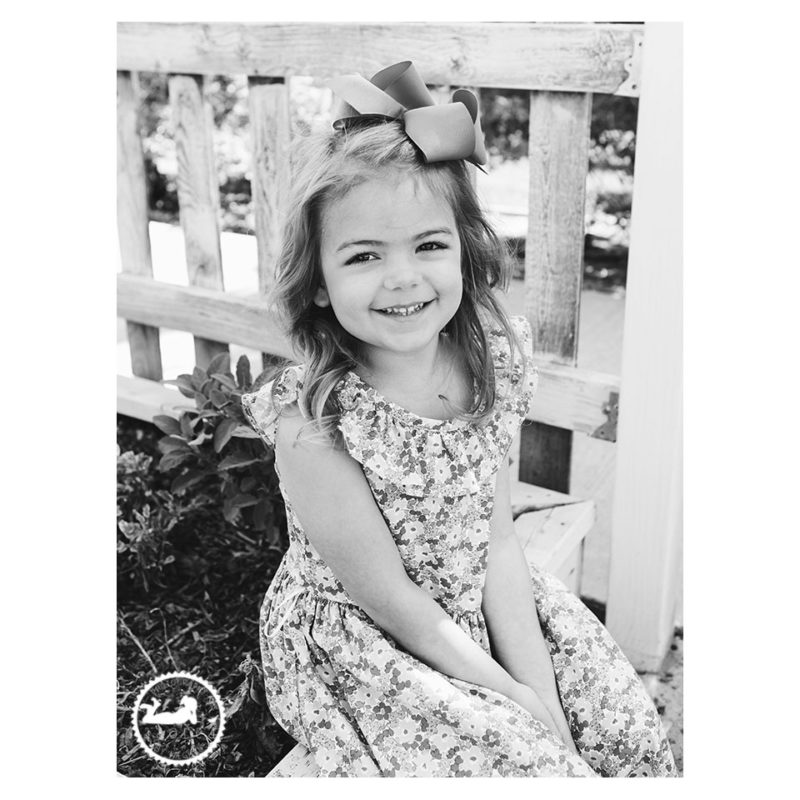 Black and White portrait of a Little girl in the garden during mini-session with Adored by Meghan