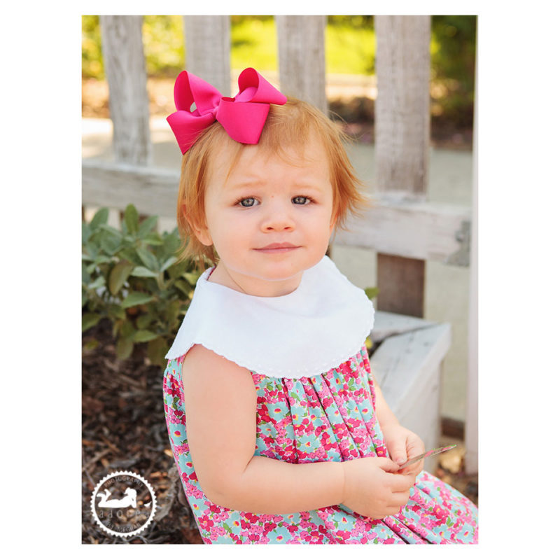 Little girl in the garden during mini-session with Adored by Meghan